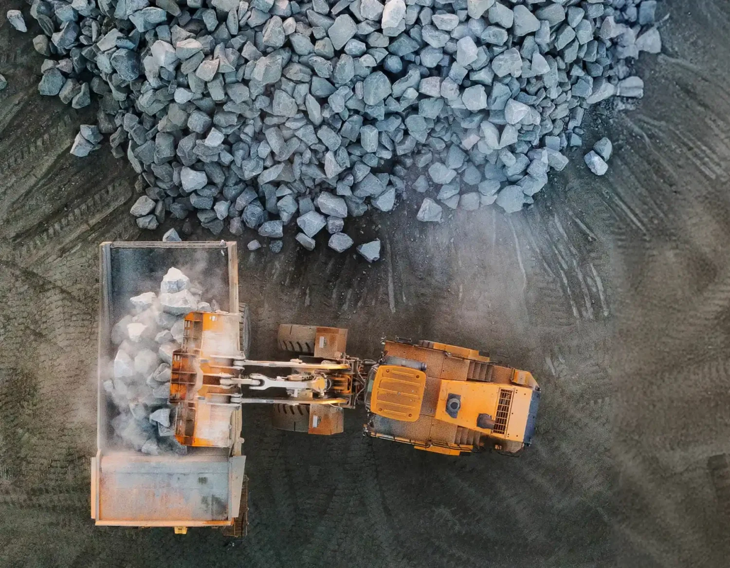 excavator and rocks